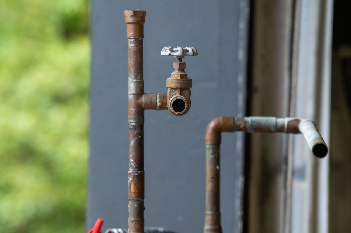 Rusty water pipe and valve, a common source of sand and sediment in well water