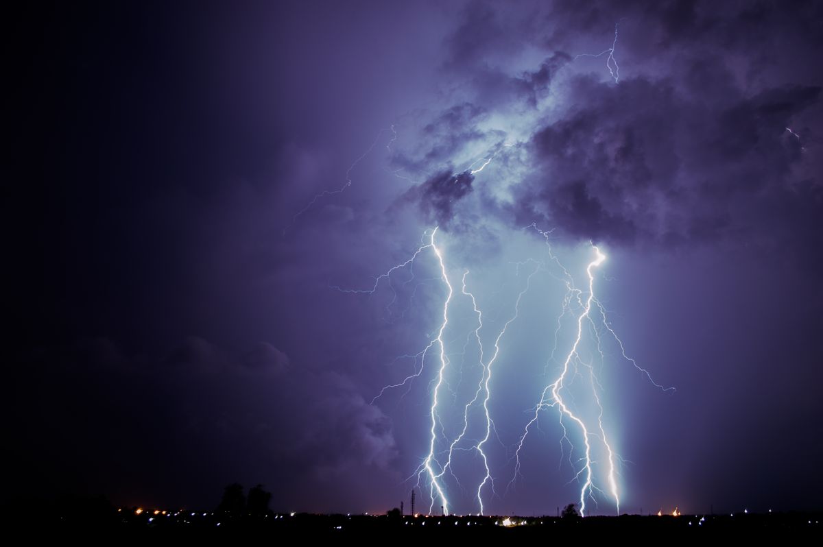 Lightning strike near rural power lines, a common cause of well pump surge damage
